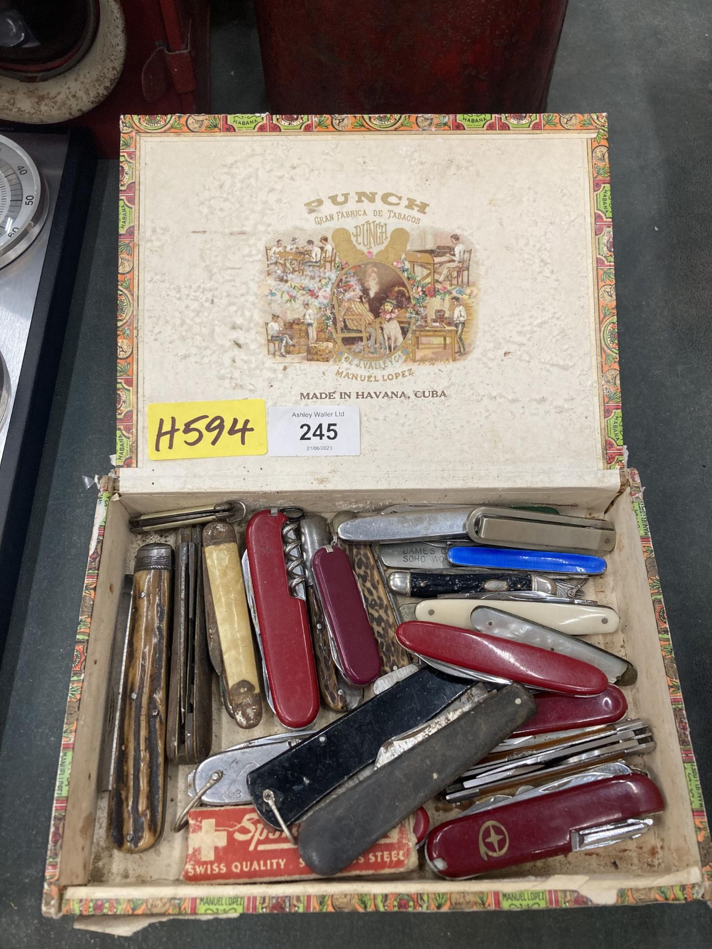 A BOX OF VINTAGE SWISS ARMY KNIVES