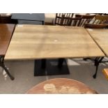 A 47X29.5" OAK PUB TABLE ON METALWARE BASE