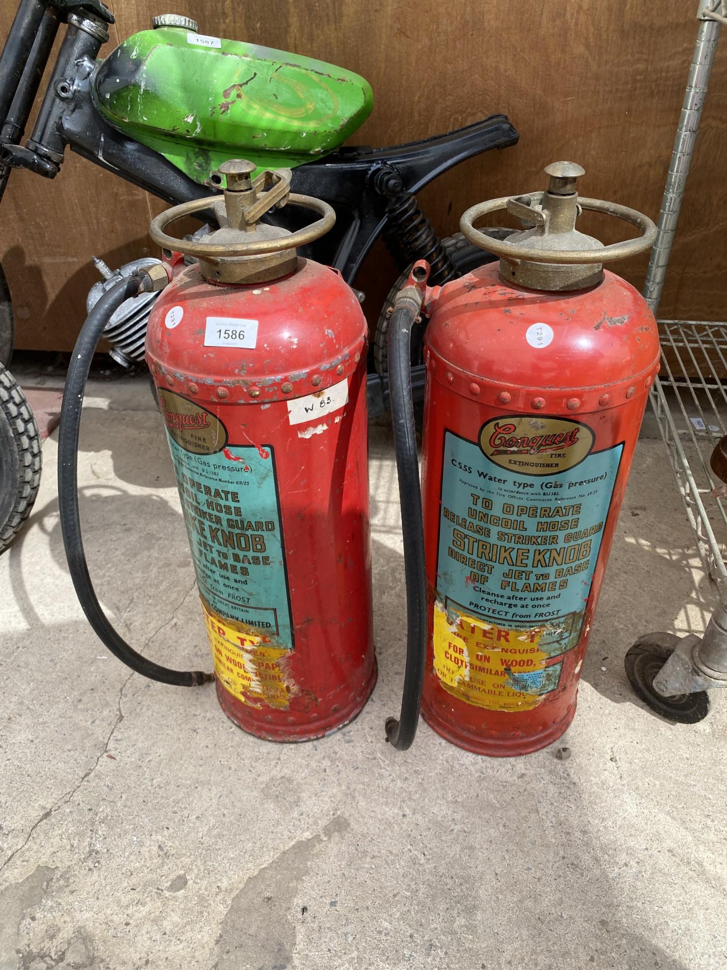 TWO VINTAGE CONQUEST FIRE EXTINGUISHERS