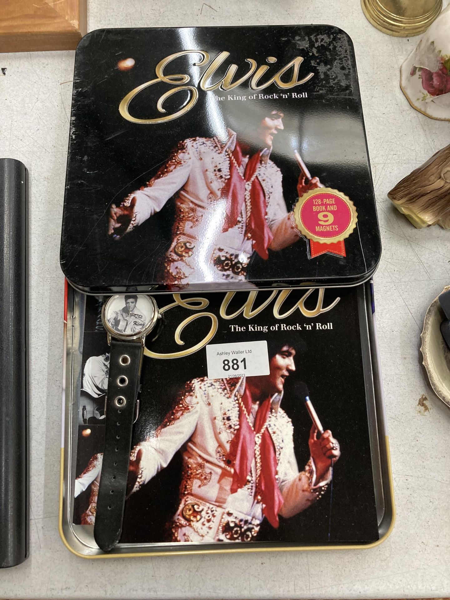 AN ELVIS WRISTWATCH PLUS A BOOK AND MAGNETS IN A PRESENTATION TIN