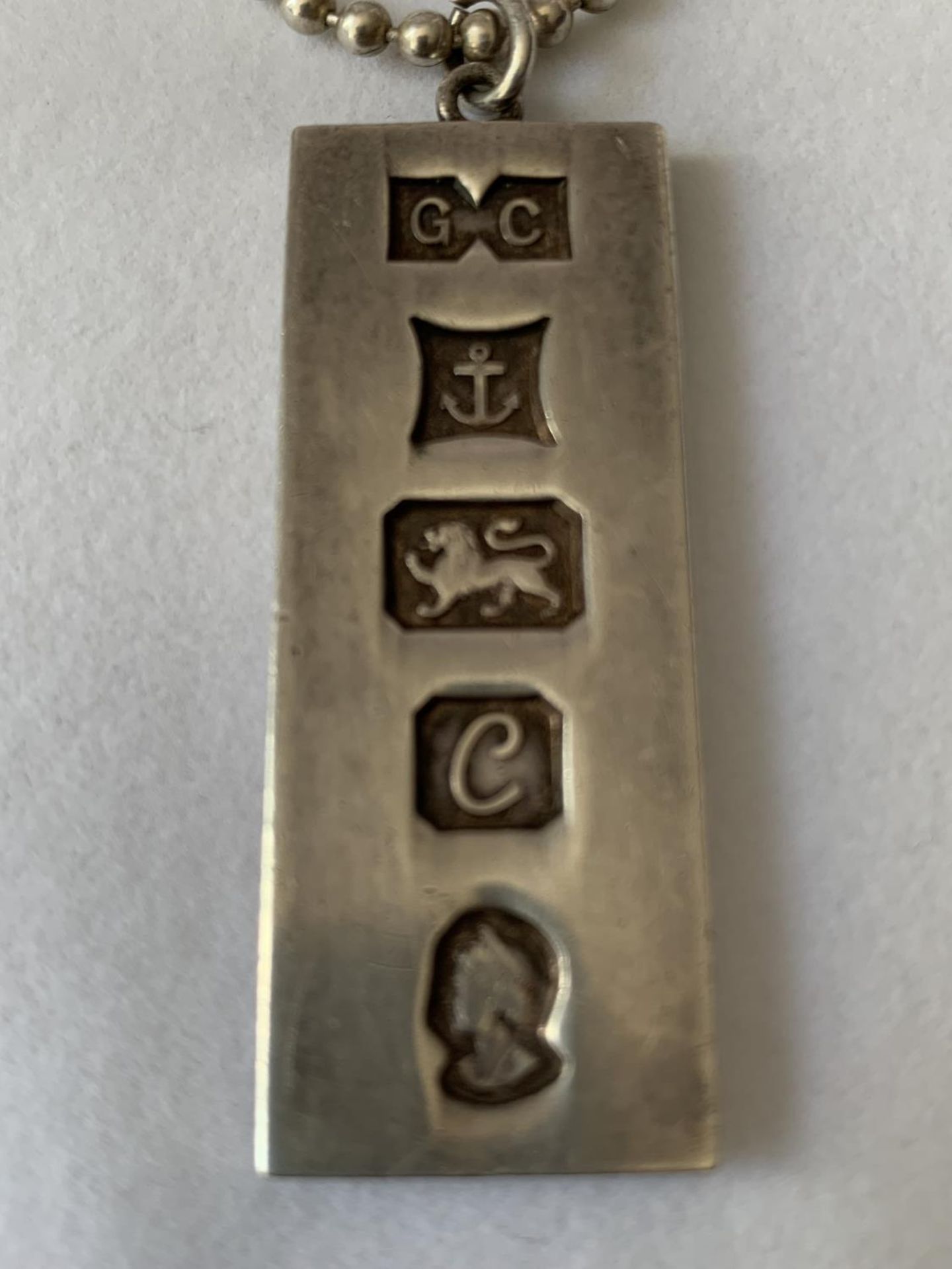 A SILVER INGOT IN A PRESENTATION BOX - Image 2 of 3