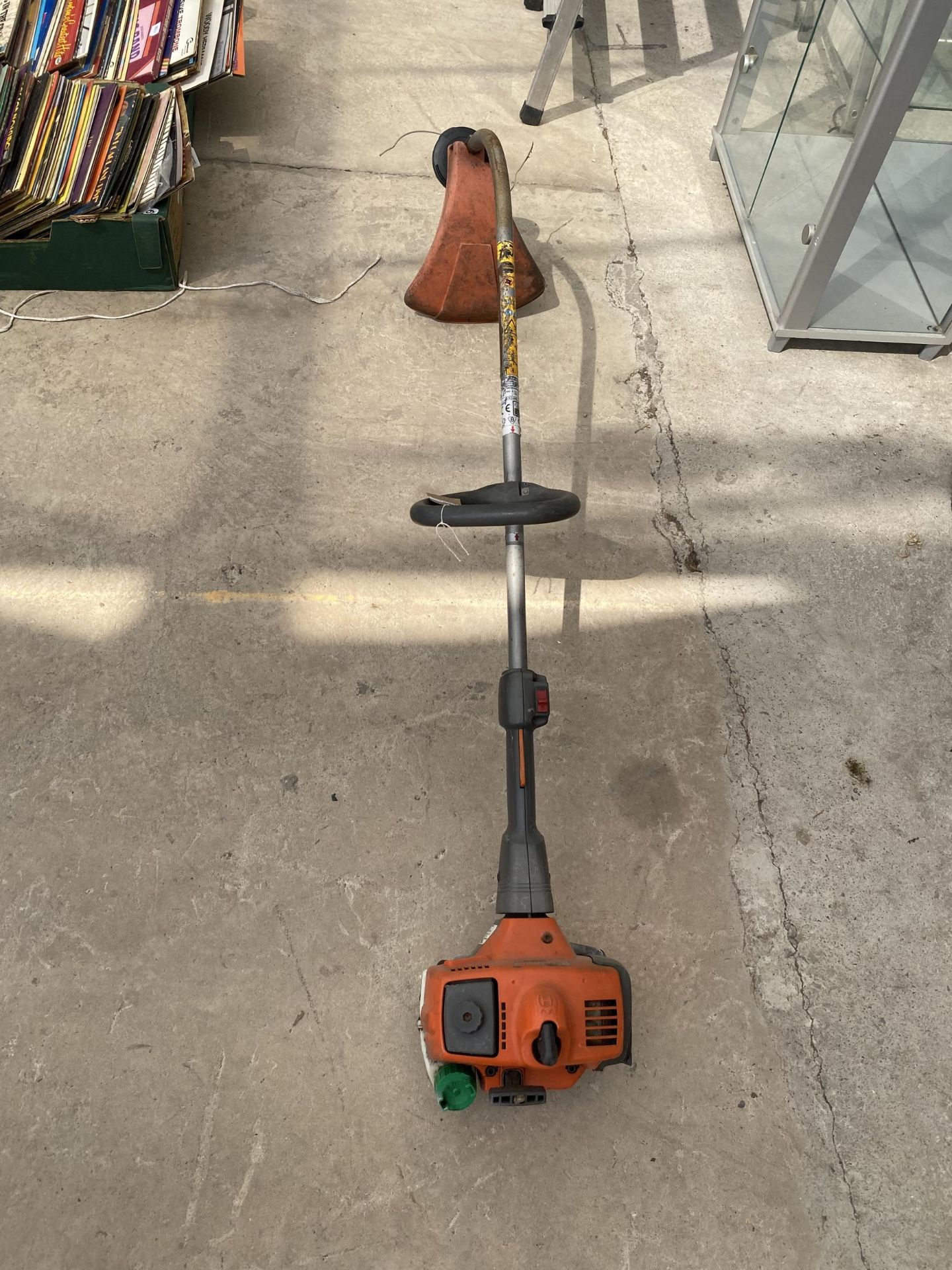 A HUSQVARNA 323C PETROL GRASS STRIMMER