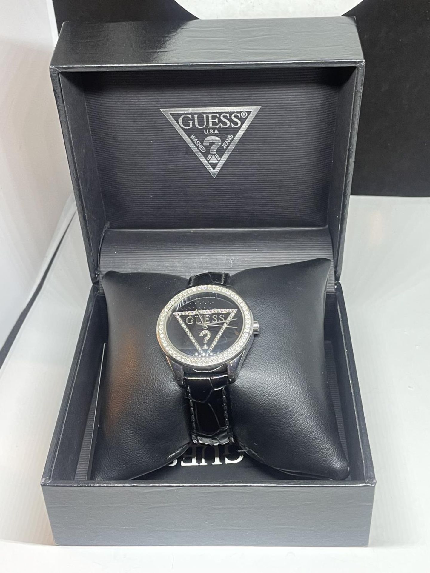 A GUESS WRIST WATCH SEEN WORKING BUT NO WARRANTY IN A PRESENTATION BOX