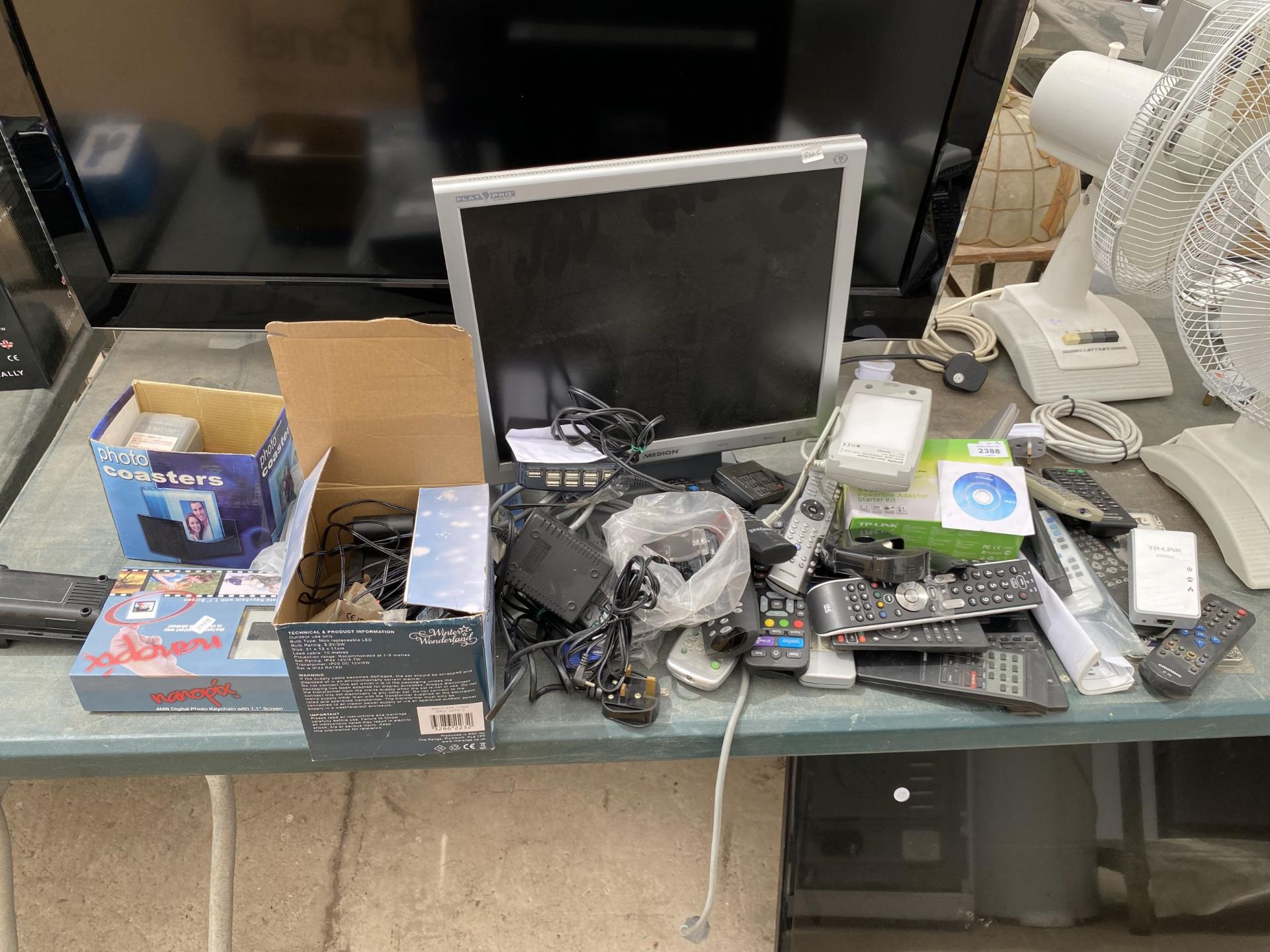 AN ASSORTMENT OF ITEMS TO INCLUDE REMOTE CONTROLS AND MONITORS ETC