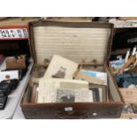 A VINTAGE LEATHER SUITCASE CONTAINING A QUANTITY OF EPHEMERA AND PHOTOGRAPHS