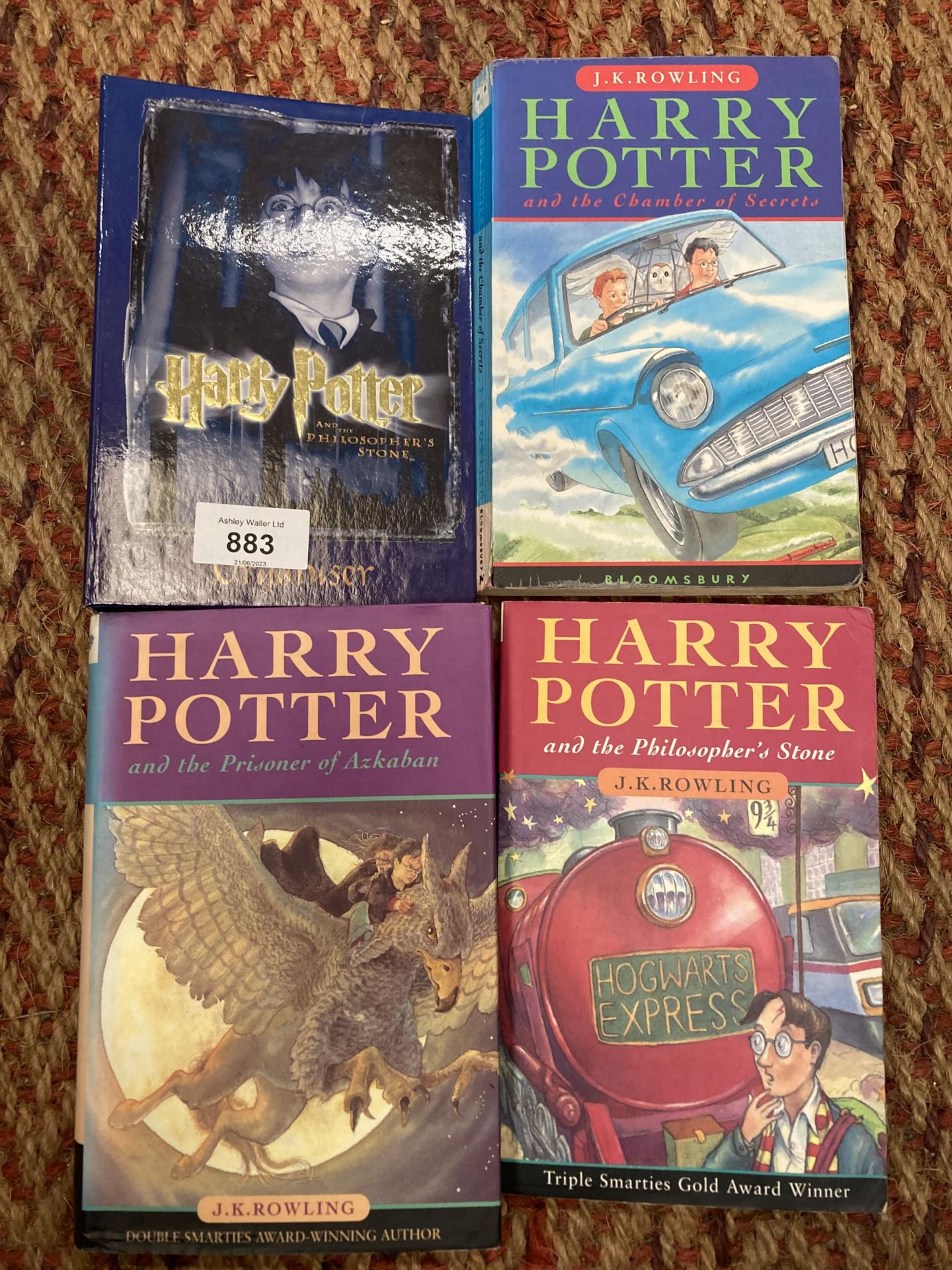 A HARRY POTTER ORGANISER AND THREE HARRY POTTER BOOKS