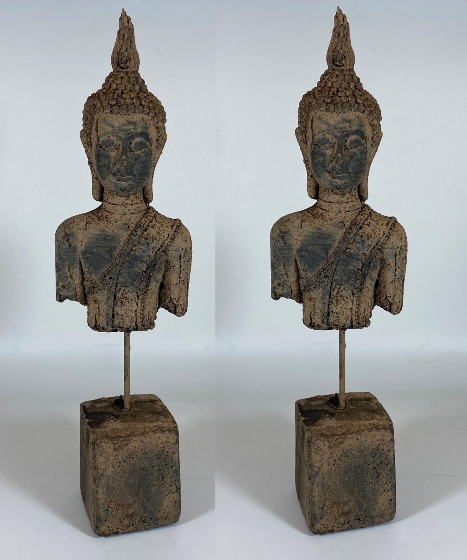 A PAIR OF DECORATIVE STONE BUDDHA HEAD ON PLINTH BASES, HEIGHT 39CM