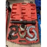 A CASED SPRING COMPRESSOR SET