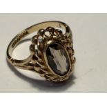 A 9 CARAT GOLD RING WITH AN OVAL SOLITAIRE STONE SIZE K GROSS WEIGHT 2.58 GRAMS