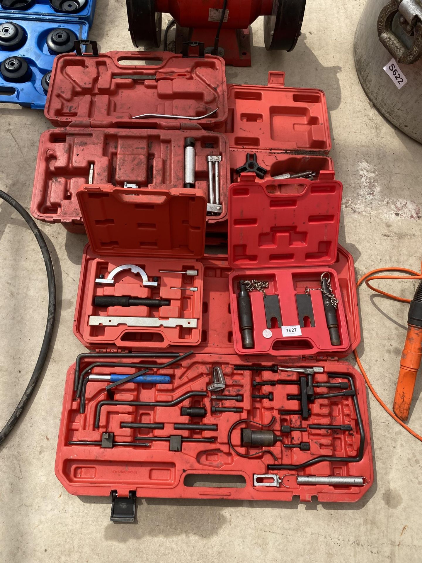 A LARGE ASSORTMENT OF CASED TOOLS TO INCLUDE AN ENGINE TIMING SET ETC