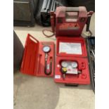 A BOXED MAC TOOLS DIFFERENTIAL CYLINDER PRESSURE TESTER, A BATTERY JUMP STARTER AND A CLARKE