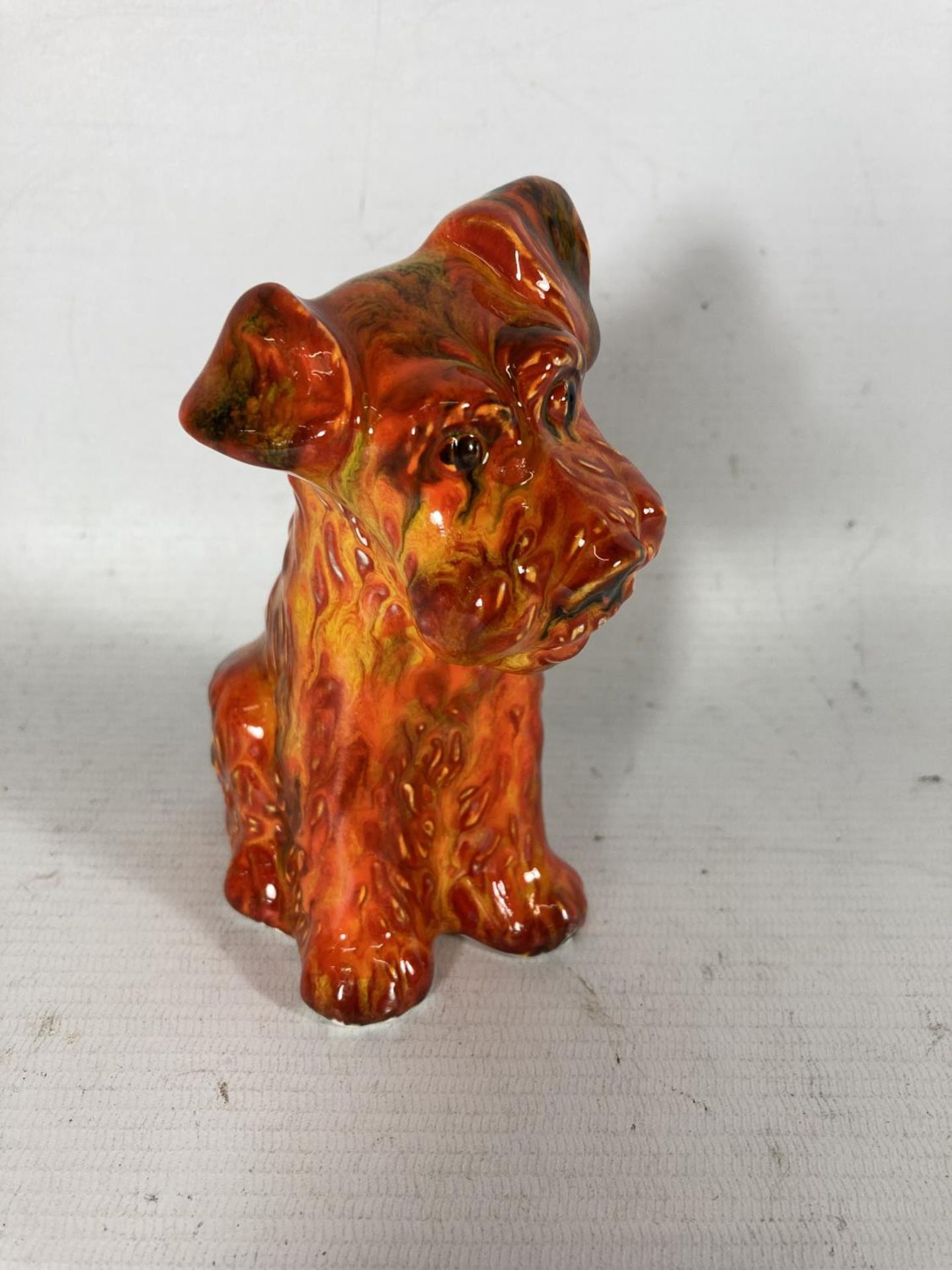 AN ANITA HARRIS TERRIER DOG FIGURE HAND PAINTED AND SIGNED IN GOLD