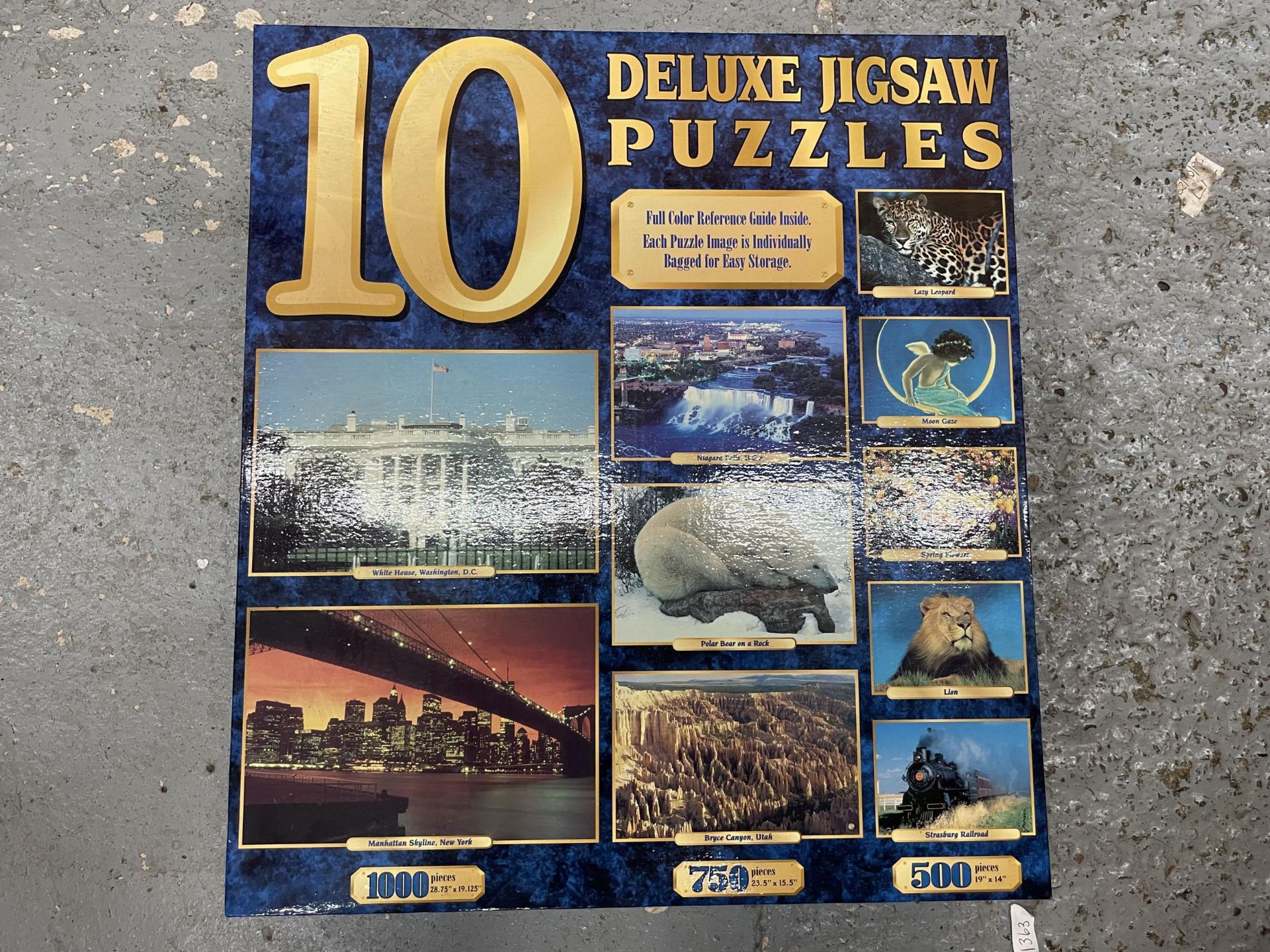 A BOX OF ASSORTED JIGSAWS AND TABLE TENNIS AND ASSORTED GAMES