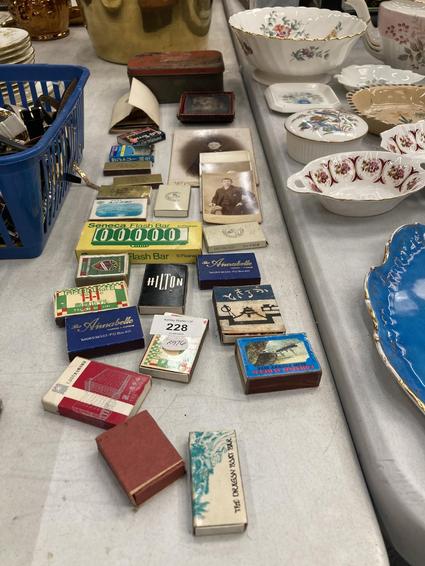 A VINTAGE LOT OF ITEMS, TINS, PHOTOS AND MATCHSTICK BOXES