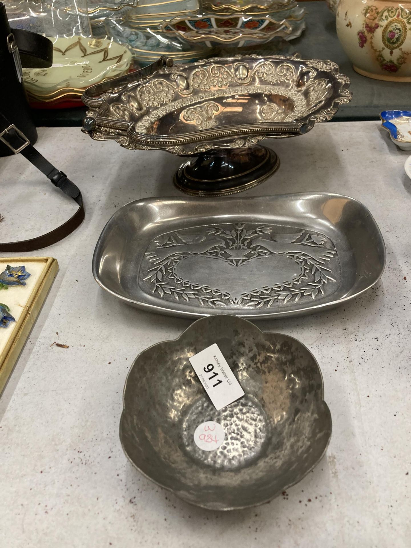 A SILVER PLATED BASKET BOWL WITH HANDLE, LOVE BIRDS TRAY AND A PEWTER BOWL