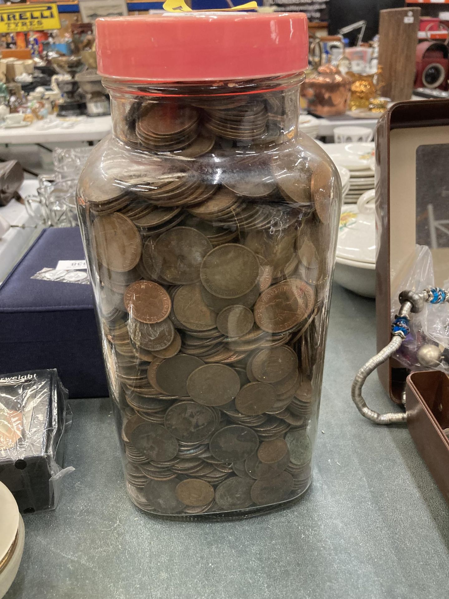 A LARGE VINTAGE SWEET JAR FILLED WITH PRE-DECIMAL PENNIES, HA'PENNIES, ETC