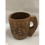 A LARGE VINTAGE TRIBAL WOODEN MUG, HEIGHT 25CM