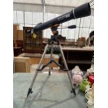 A CELESTRON ASTROMASTER TELESCOPE WITH TRIPOD STAND