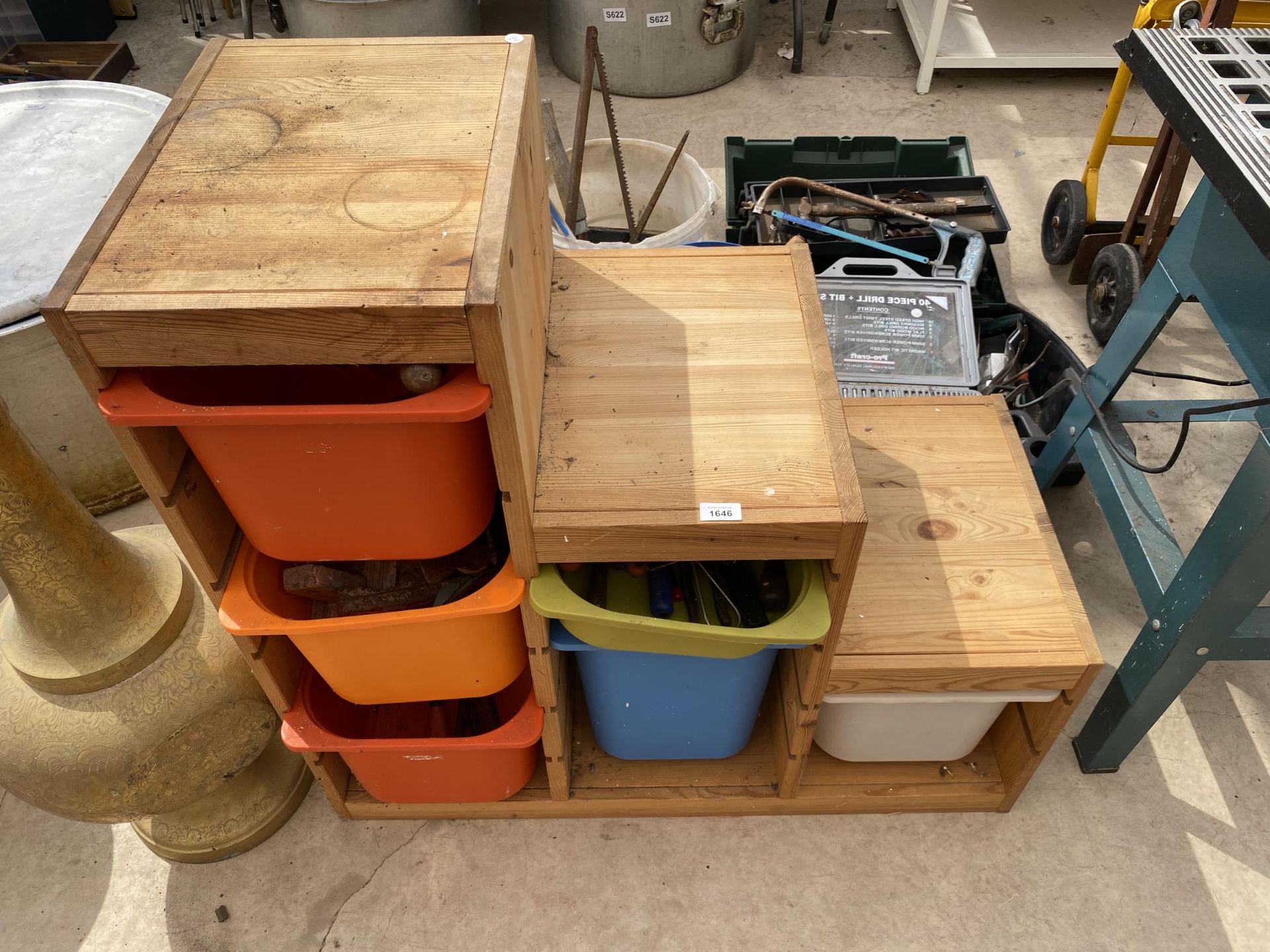 A WOODEN STORAGE CHEST CONTAINING A LARGE ASSORTMENT OF TOOLS TO INCLUDE HAMMERS, FILES AND SNIPS