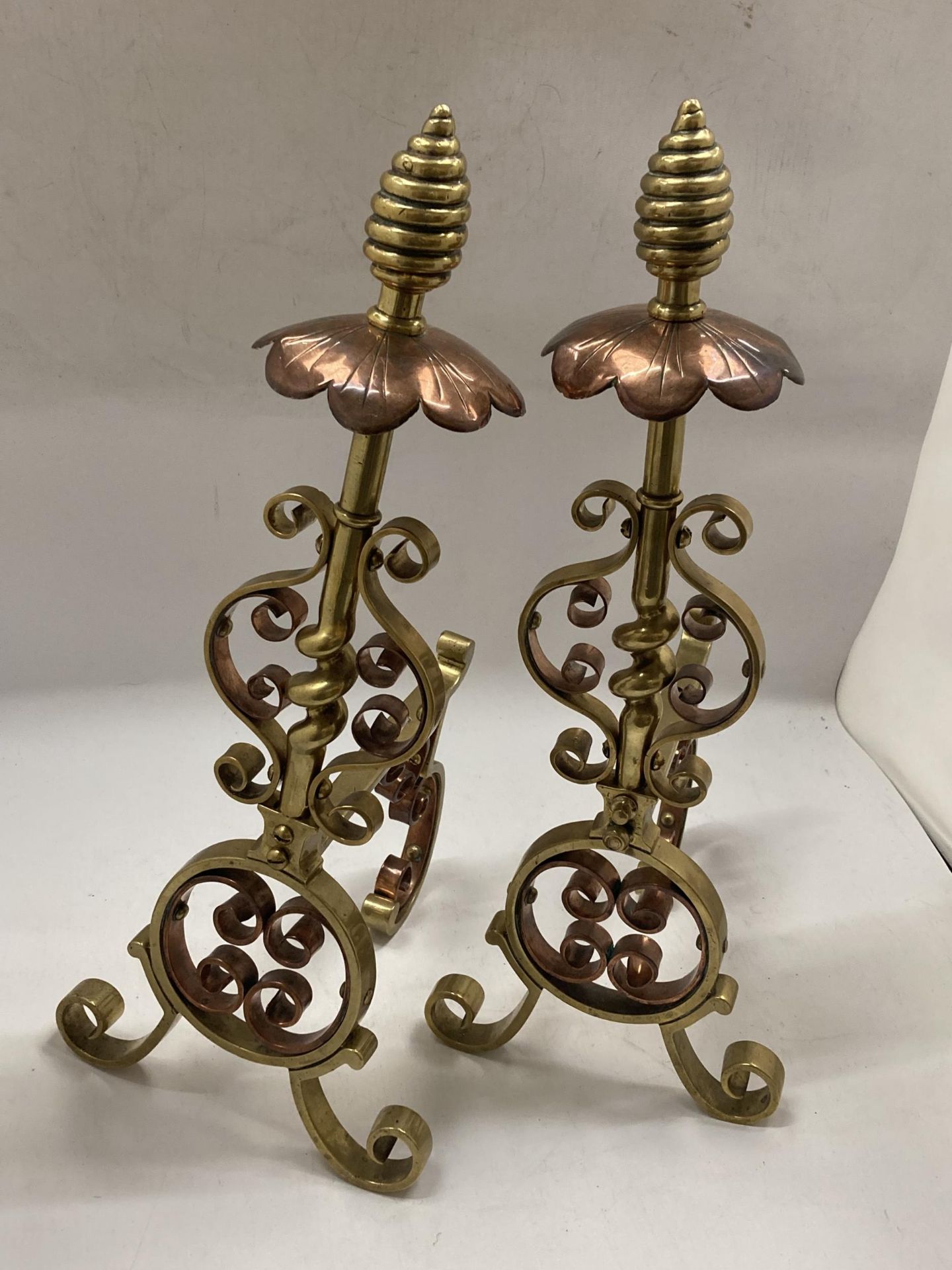 A PAIR OF BRASS AND COPPER ARTS AND CRAFTS FIRE DOGS - Image 2 of 2