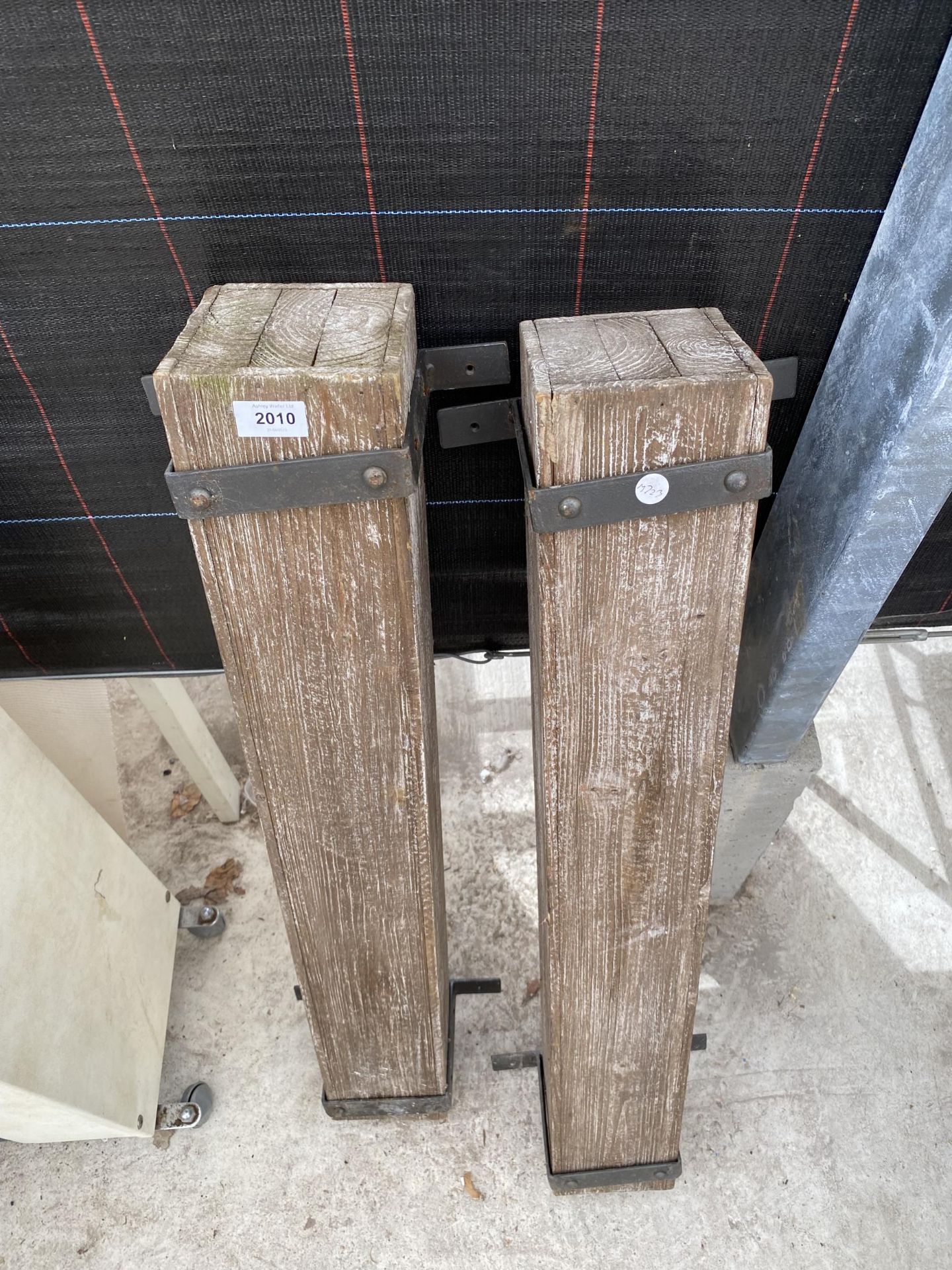 A PAIR OF WOODEN BOLT ON POSTS