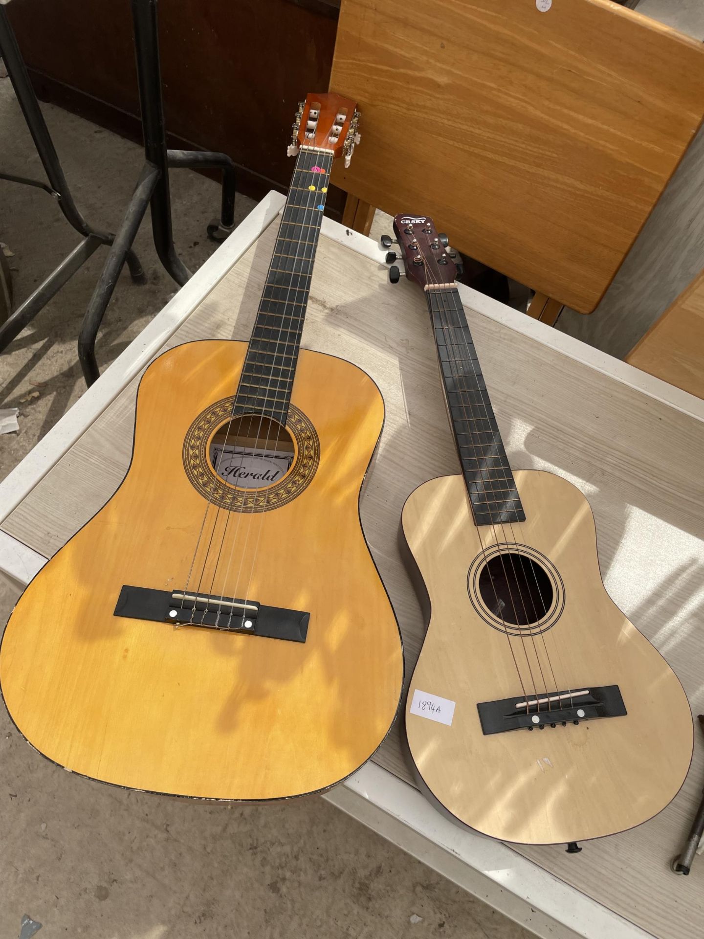 A HERALD ACOUSTIC GUITAR AND A FURTHER CHILDS ACOUSTIC GUITAR