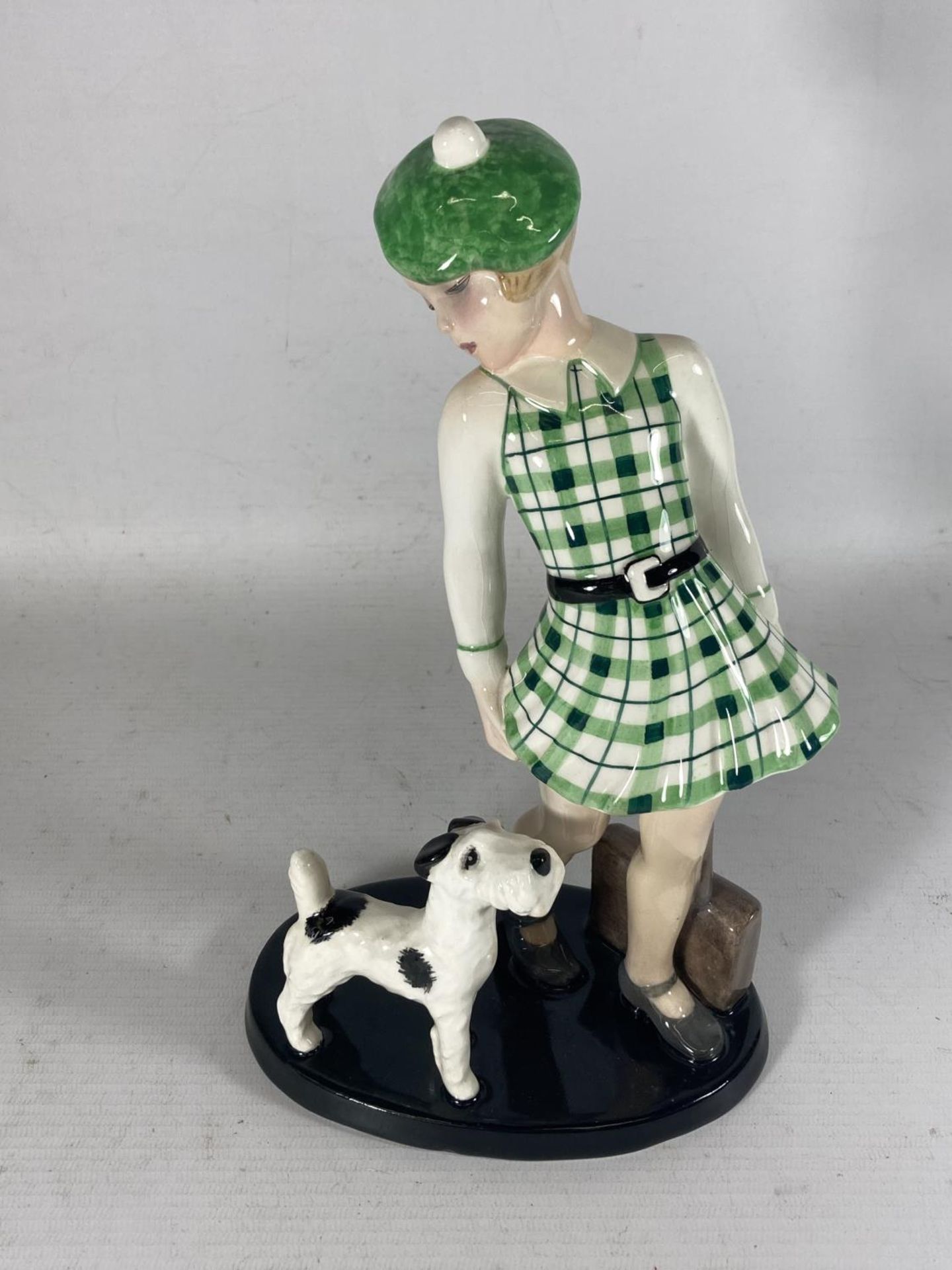 A GOLDSCHEIDER WEIN CLAIRE WEISS FIGURE OF A GIRL AND A TERRIER