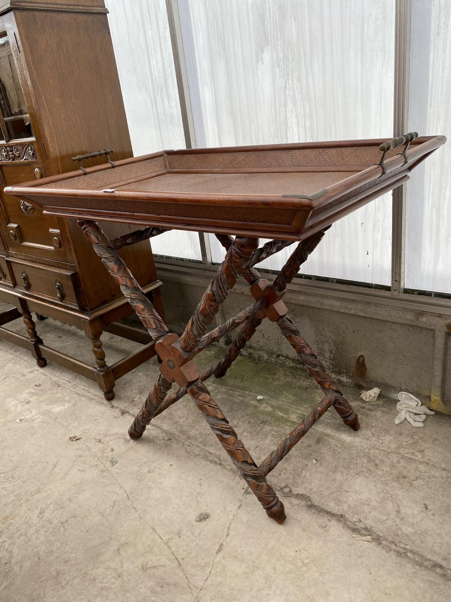 AN ORIENTAL HARDWOOD AND CANE TWO HANDLED TRAY ON HEAVILY CARVED X-FRAME STAND, 38X24" - Image 2 of 5