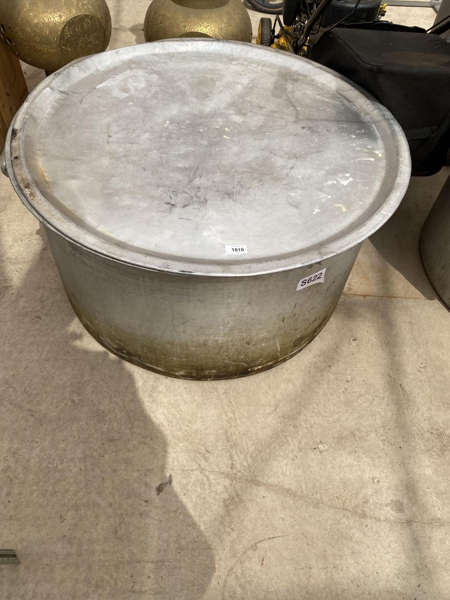 A VERY LARGE STAINLESS STEEL COOKING POT WITH LID