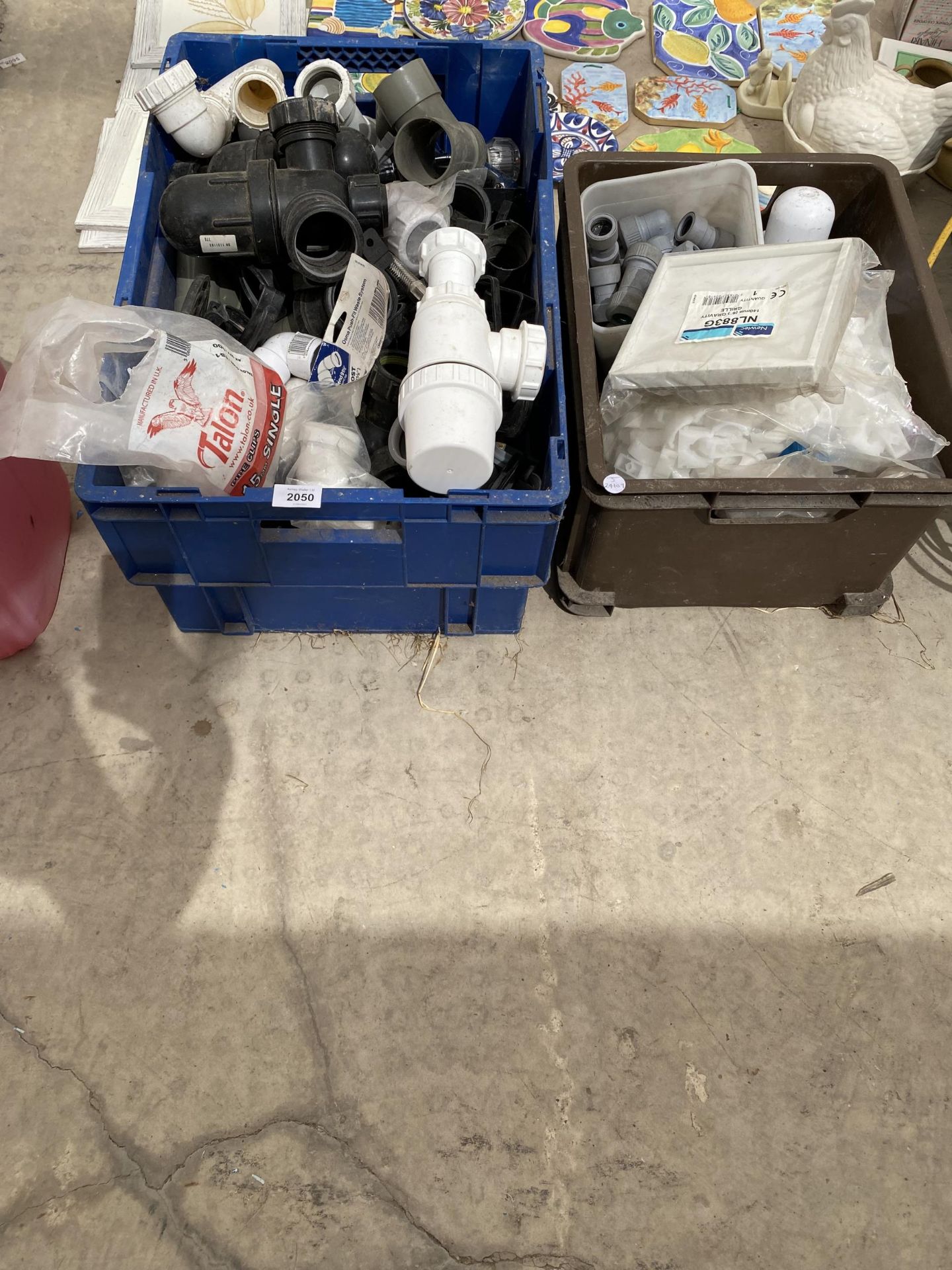 A LARGE ASSORTMENT OF PLASTIC PLUMBING FITTINGS