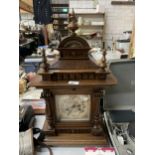 A LARGE MAHOGANY CASED MANTLE CLOCK WITH COLUMN CARVING, IN NEED OF RESTORATION
