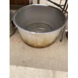 A LARGE STAINLESS STEEL COOKING POT
