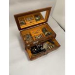A JEWELLERY BOX CONTAINING A QUANTITY OF COSTUME JEWELLERY TO INCLUDE RINGS, BRACELETS, BROOCHES,