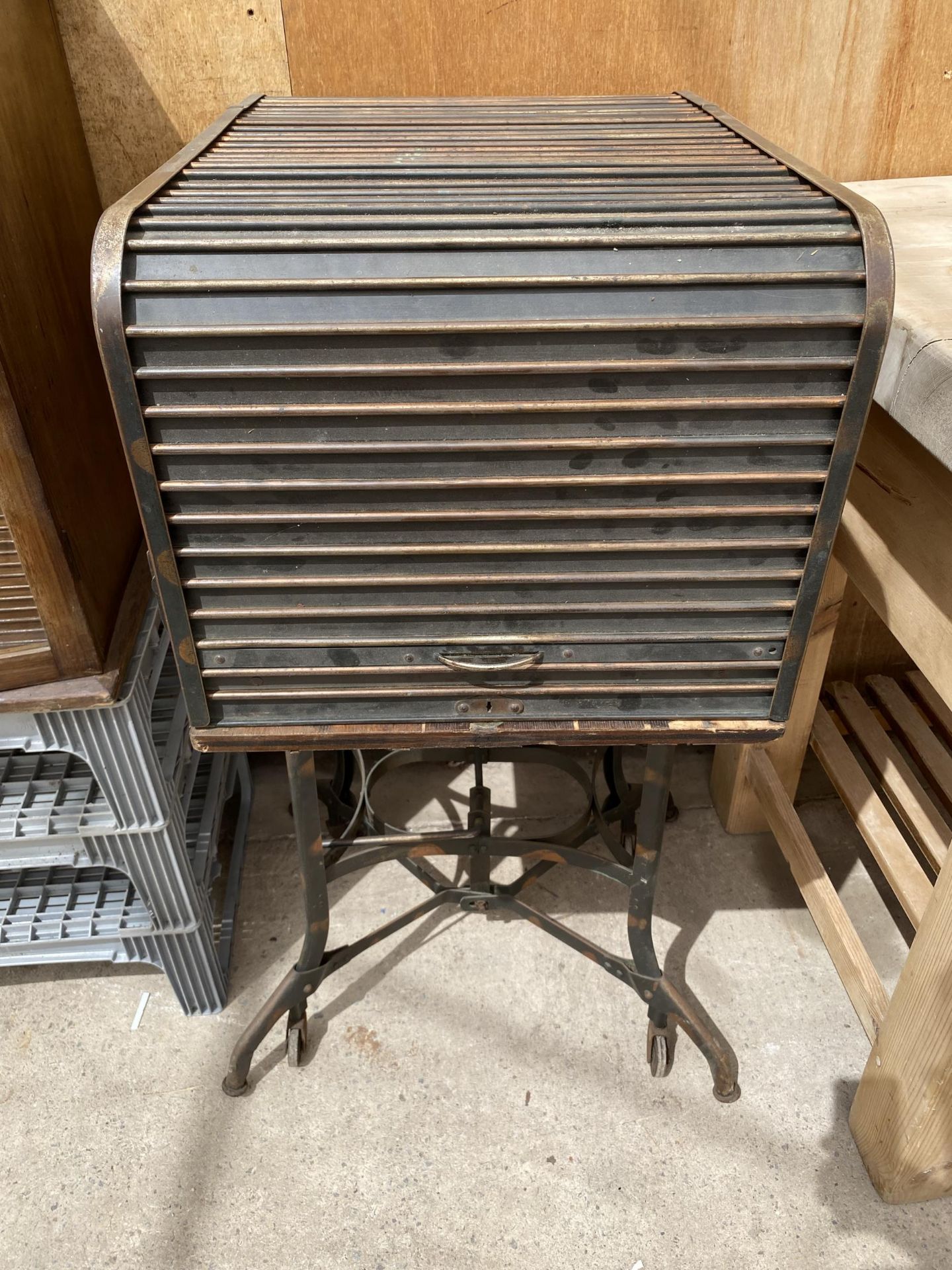 A VINTAGE OAK ROLL MACHINE TYPISTS CABINET WITH METAL INDUSTRIAL BASE