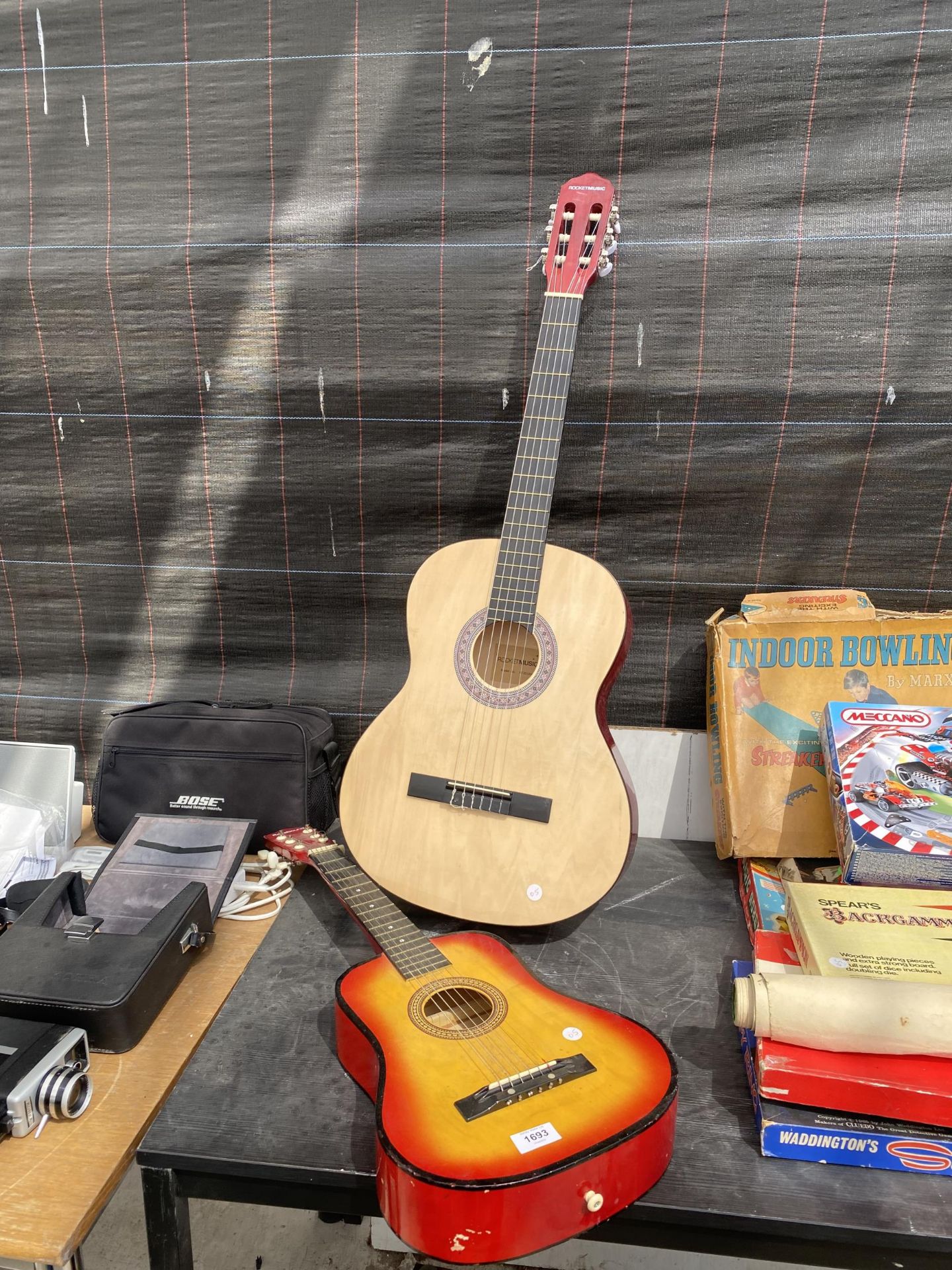 A ROCKET MUSIC ACOUSTIC GUITAR AND A FURTHER CHILDS ACOUSTIC GUITAR