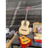 A ROCKET MUSIC ACOUSTIC GUITAR AND A FURTHER CHILDS ACOUSTIC GUITAR