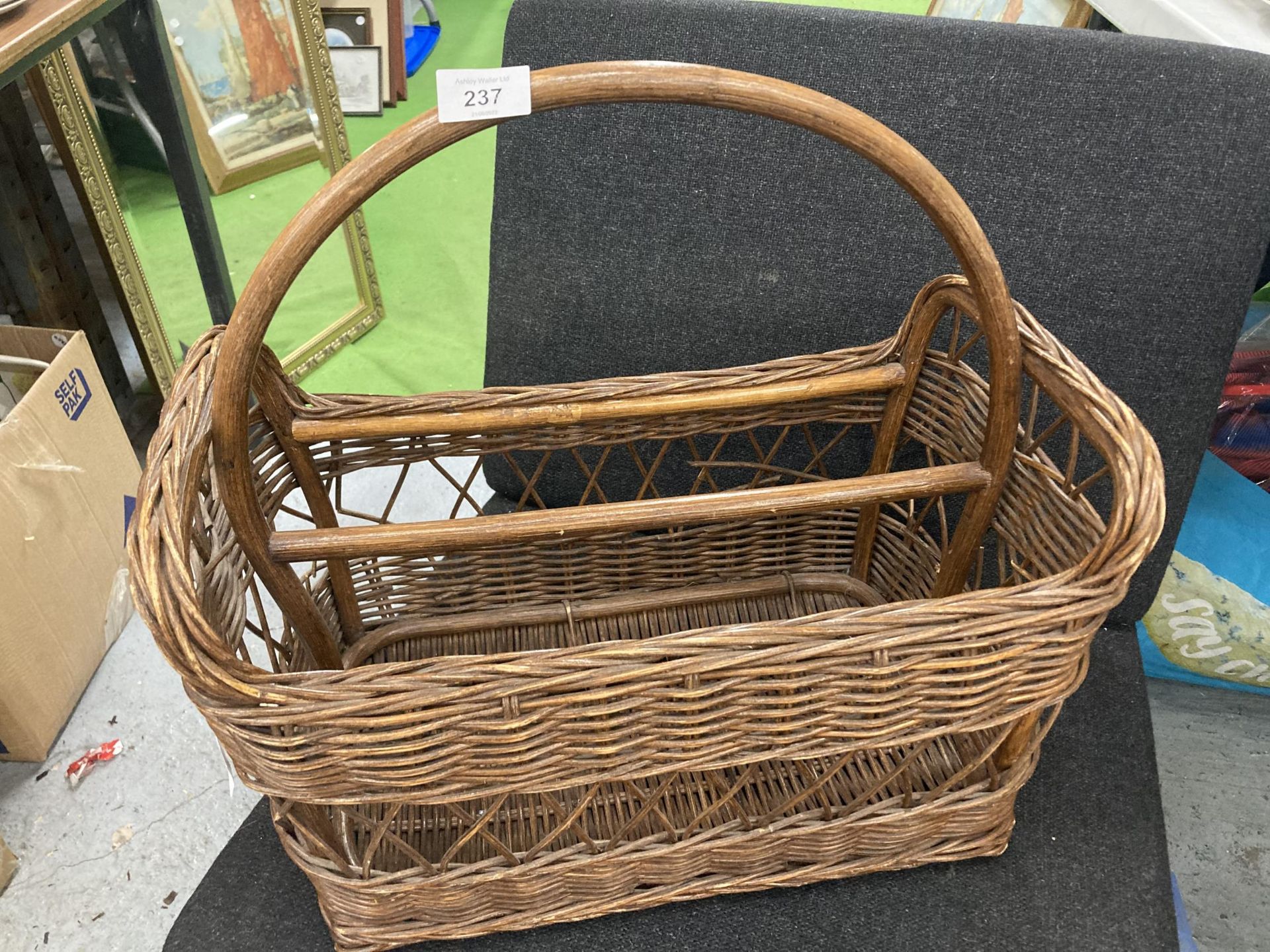 A VINTAGE WICKER BASKET