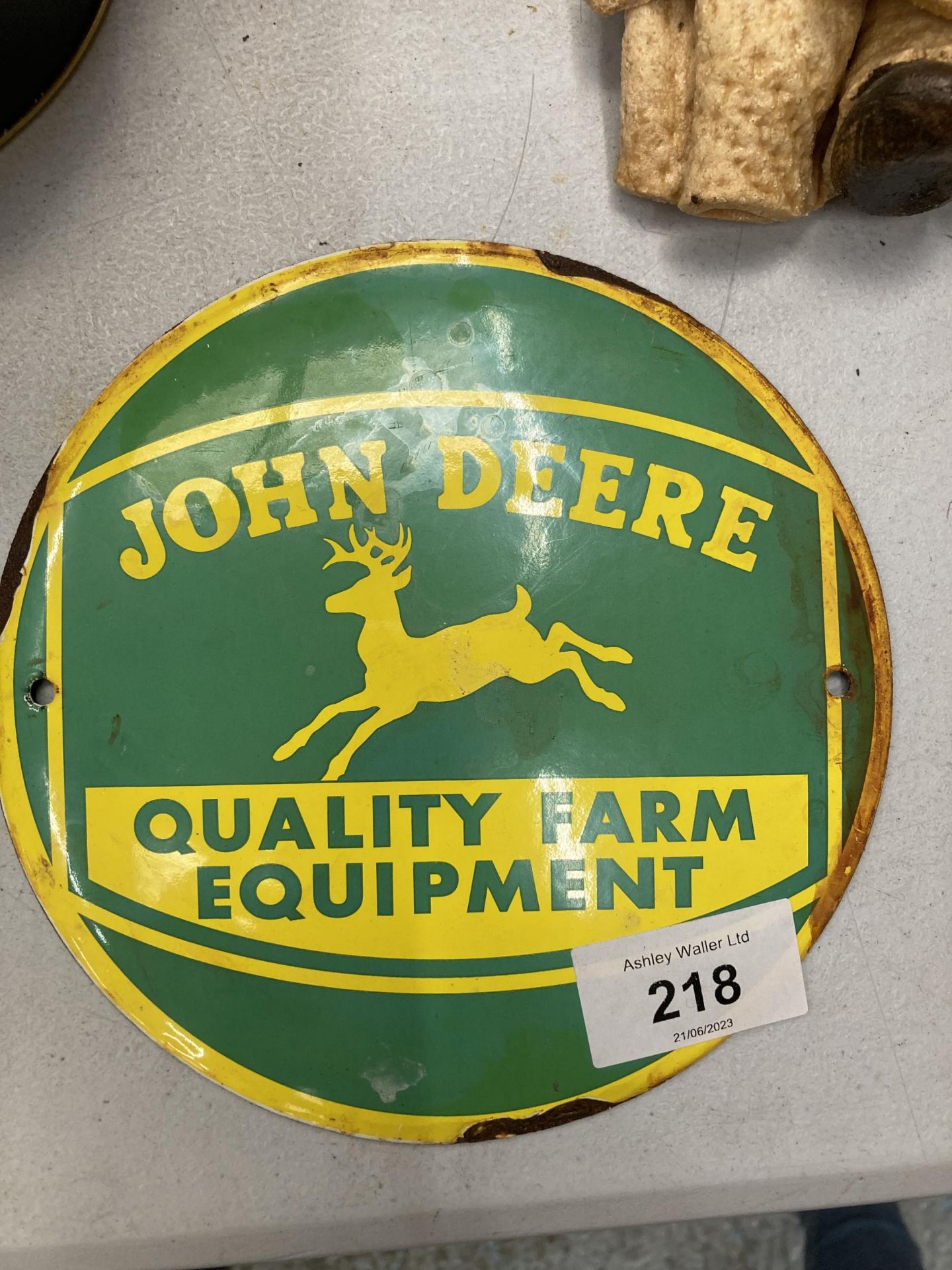 A JOHN DEERE ENAMEL SIGN DIAMETER 15CM