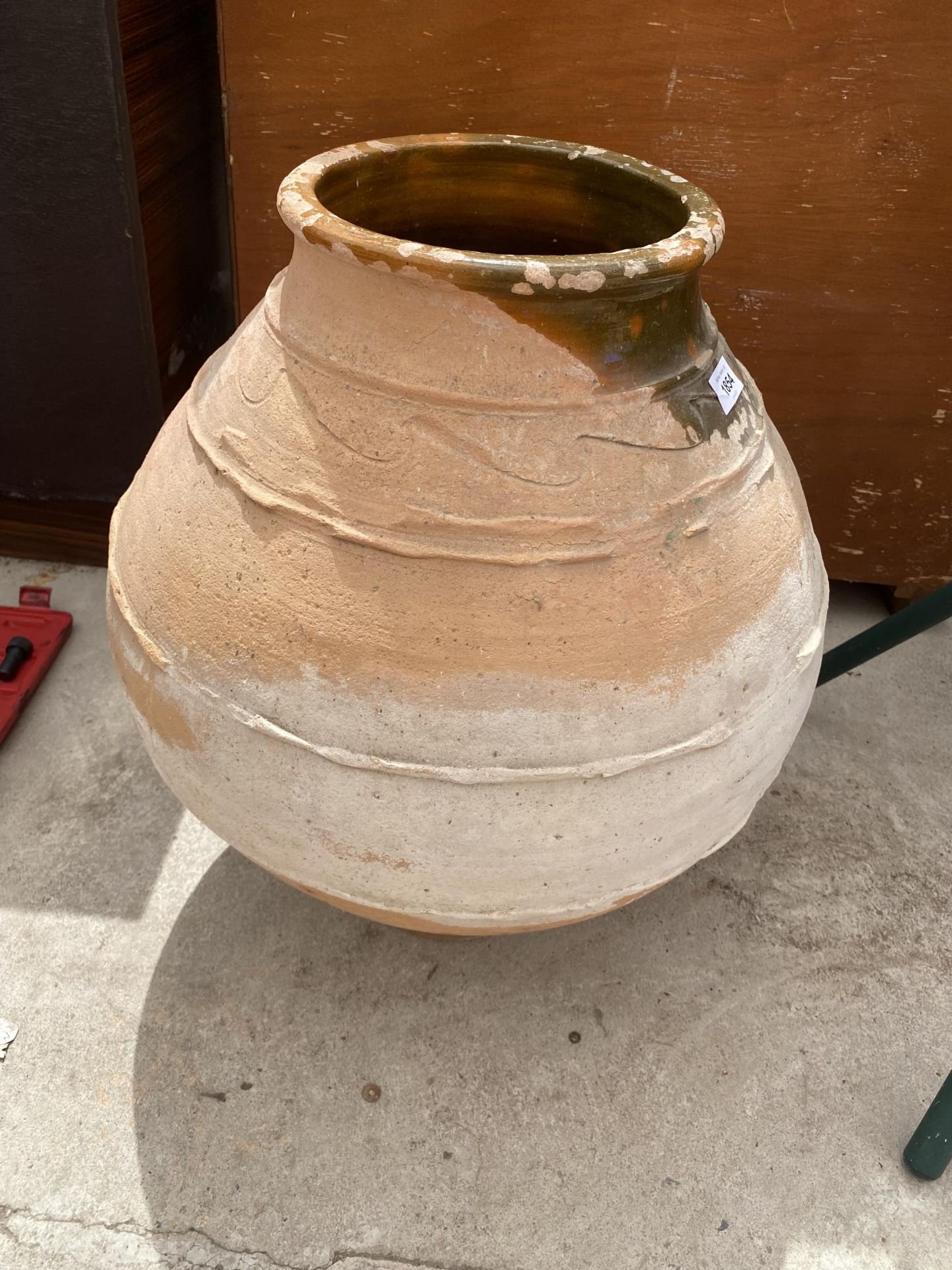 A VINTAGE TERRACOTTA AND PART GLAZED PLANTER