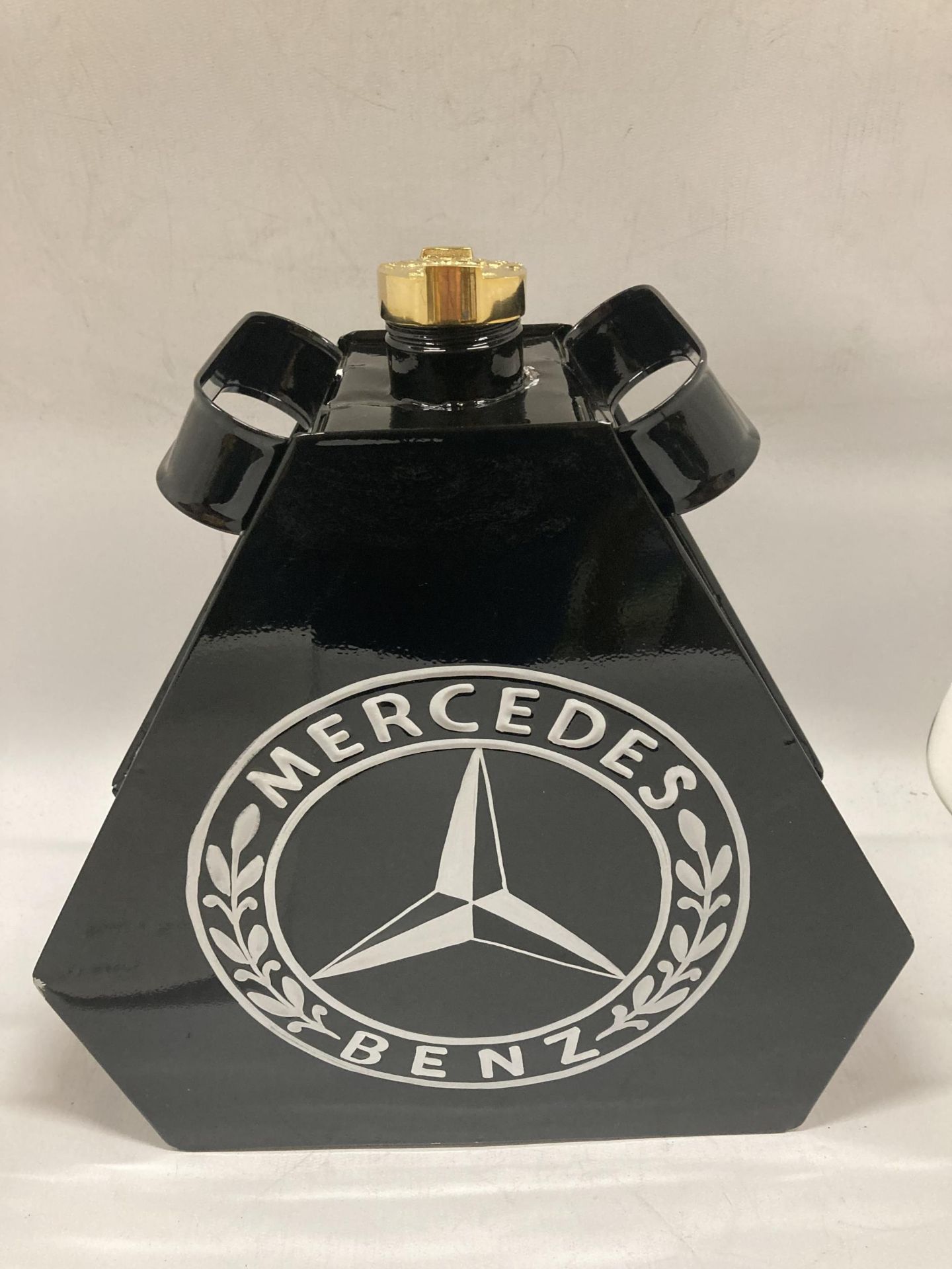 A BLACK MERCEDES METAL PETROL CAN WITH BRASS TOP