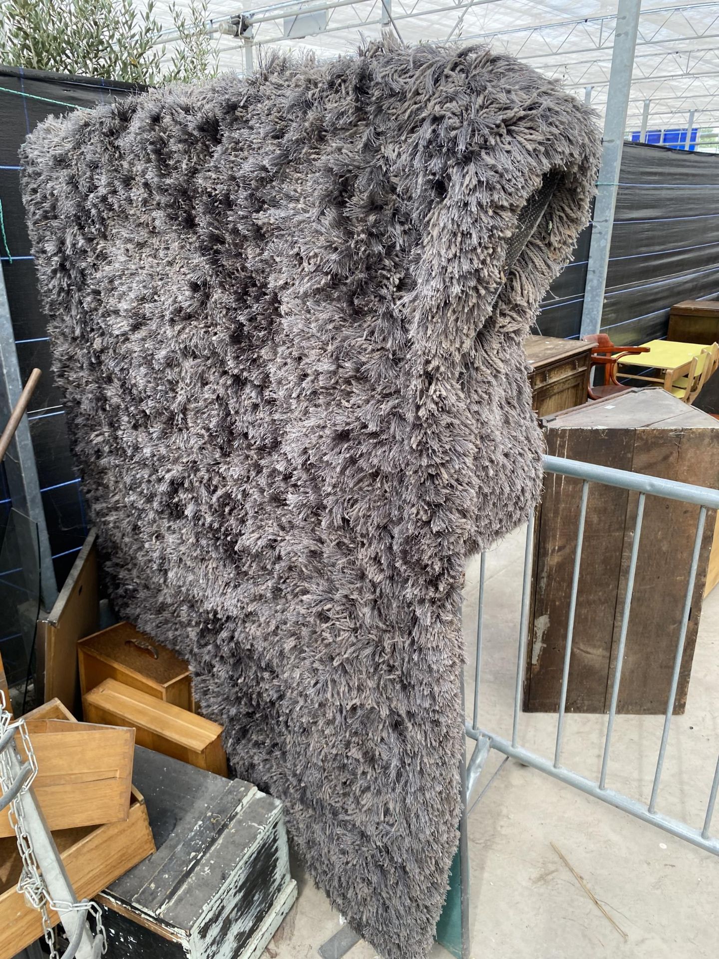 A MODERN GREY SHAGGY RUG