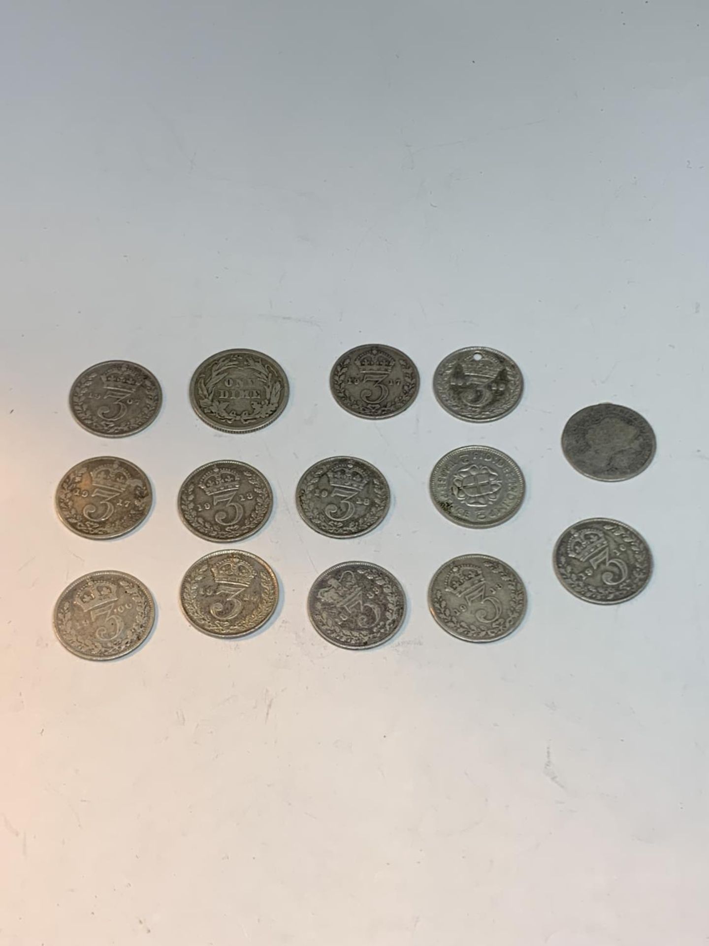 A BAG OF SILVER COINS TO INCLUDE THREE PENCES