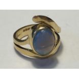 AN 18 CARAT GOLD RING WITH AN OPAL SIZE K/L GROSS WEIGHT 6.33 GRAMS