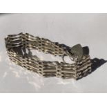 A SILVER FIVE BAR GATE BRACELET