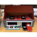 A LARGE GARAGE WITH MOBILE PETROL PUMPS WITH A LARGE COLLECTION OF DIECAST MODEL VEHICLES