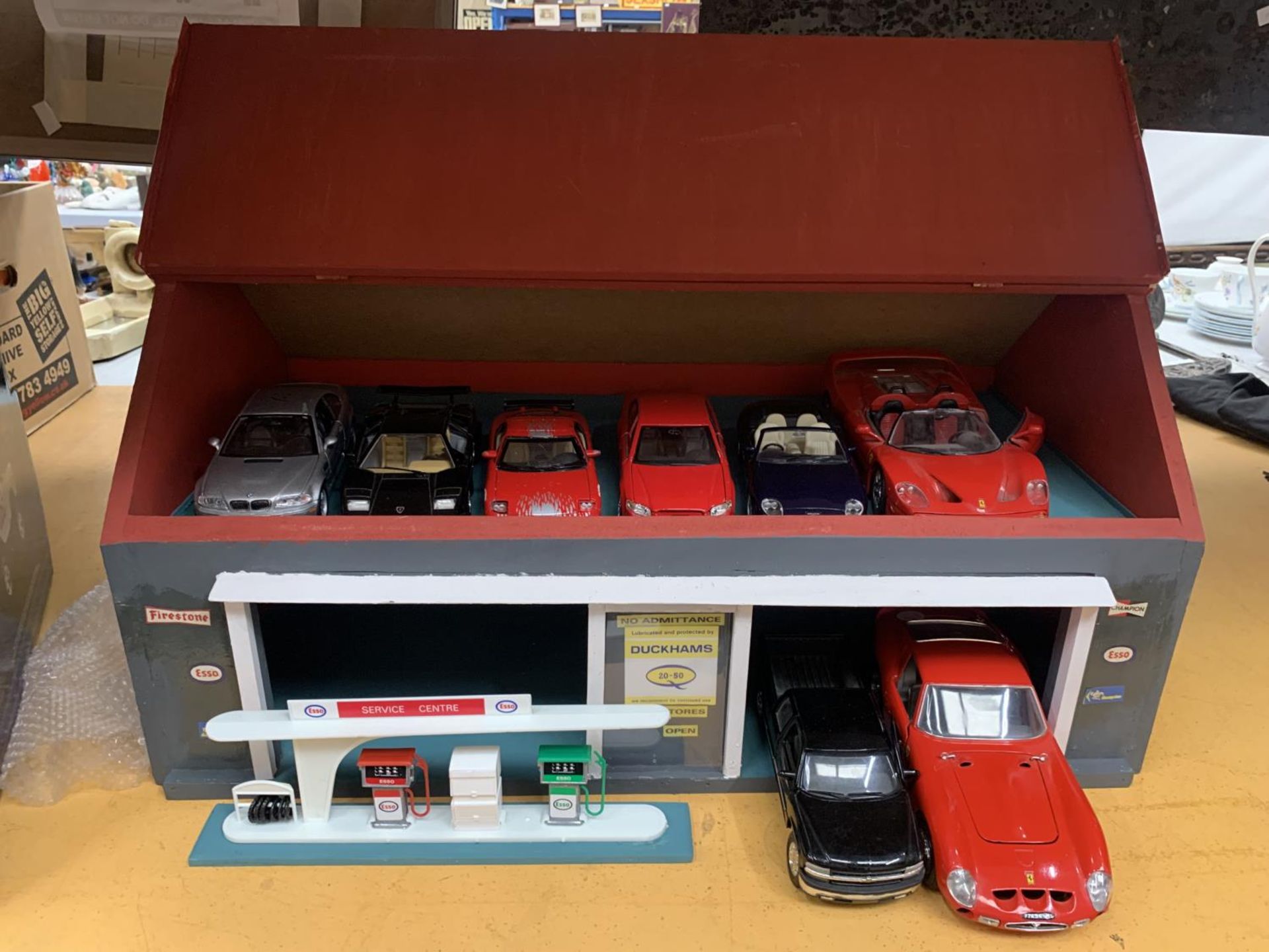A LARGE GARAGE WITH MOBILE PETROL PUMPS WITH A LARGE COLLECTION OF DIECAST MODEL VEHICLES