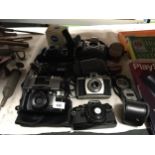 A QUANTITY OF CAMERAS TO INCLUDE AN OLYMPUS OM 10, KODAK BROWNIE 44A, NIKON F80, FUJI DL-800 ZOOM,