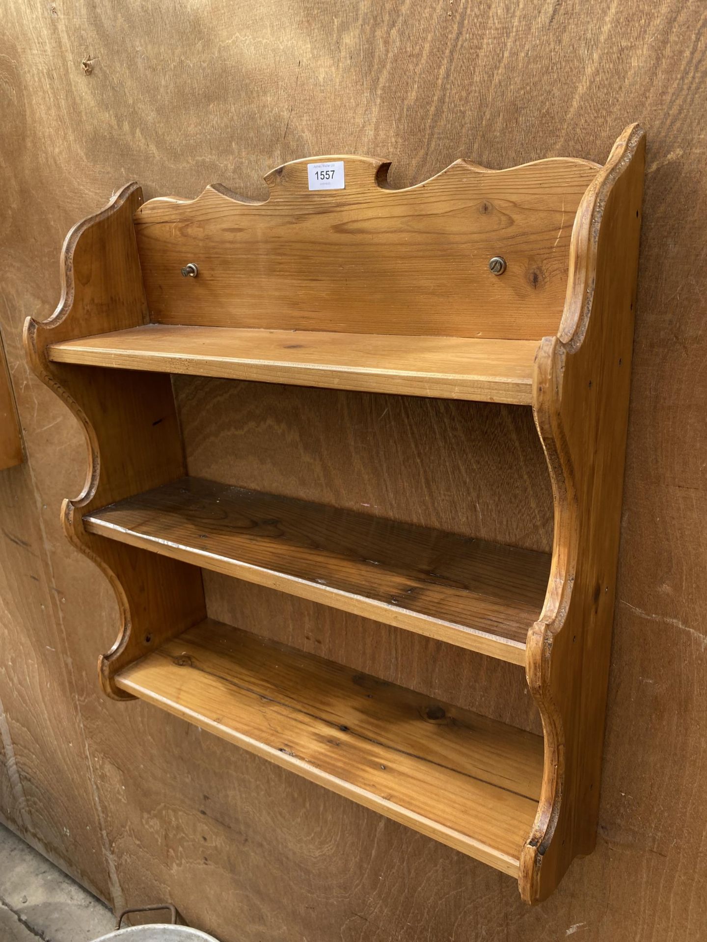 A SMALL PINE THREE TIER WALL SHELVING UNIT