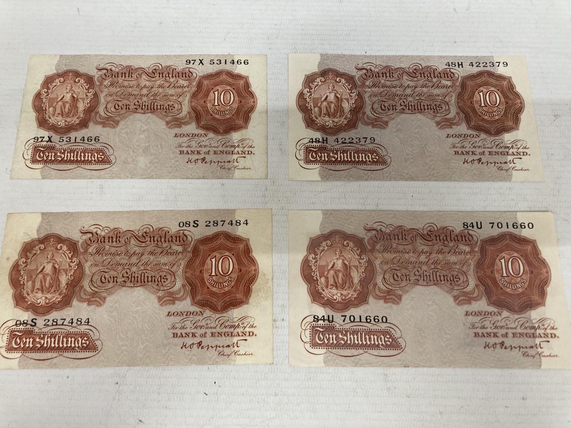 FOUR 1934 TO 1949 BANK OF ENGLAND TEN SHILLINGS NOTES SIGNED PEPPIATT