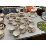 A LARGE QUANTITY OF ROYAL WORCESTER 'ROYAL GARDEN' TEAWARE TO INCLUDE A TEAPOT, PLATES, CUPS,